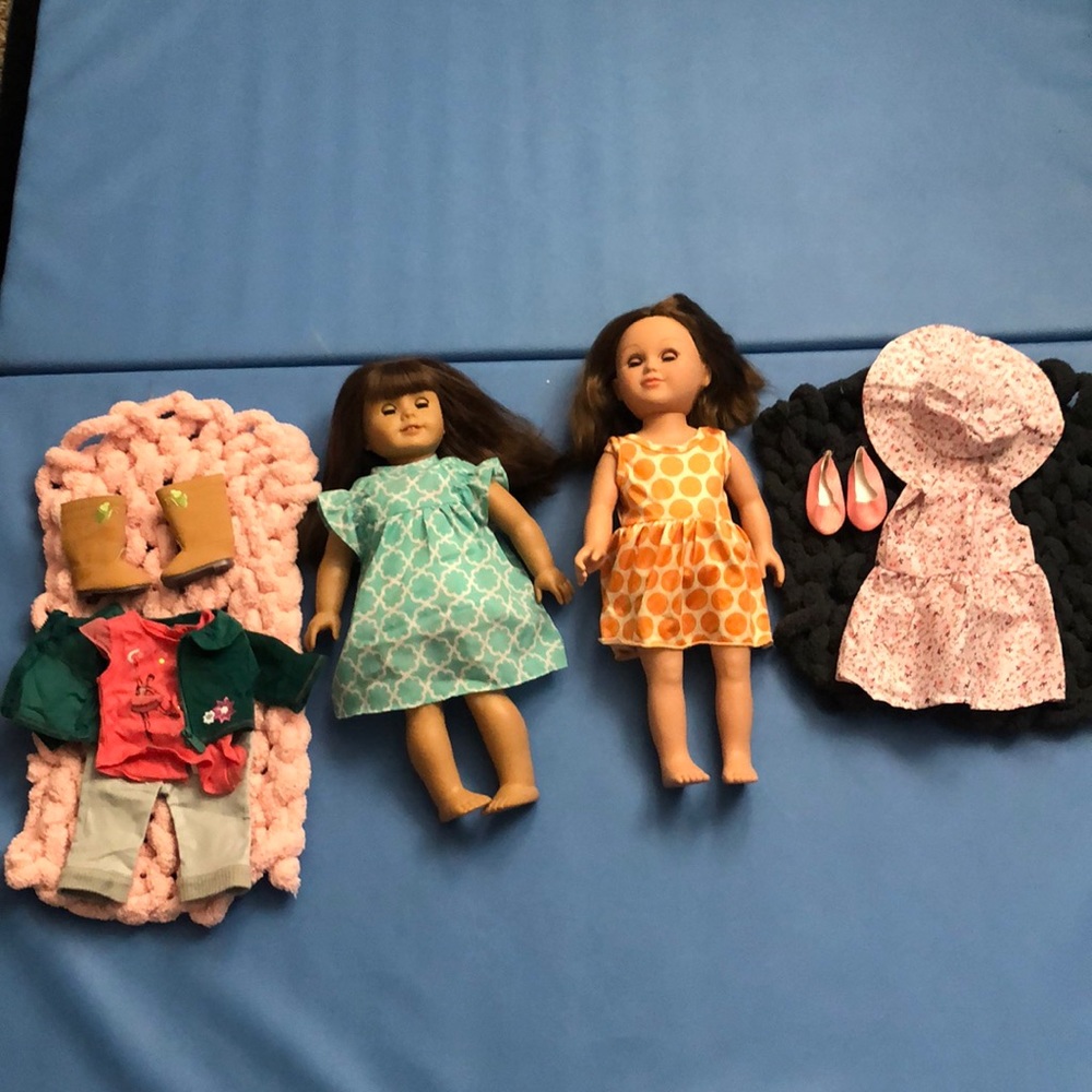 1 American girl doll with clothes and a free doll